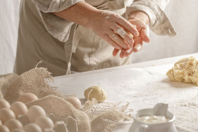 Midsection of man preparing food