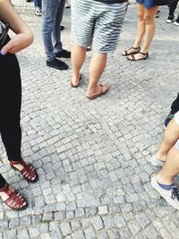 Low section of woman standing on ground