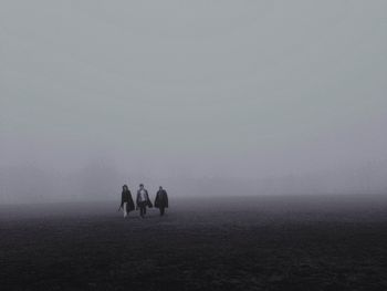 Man standing in foggy weather