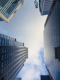 Low angle view of buildings against sky in city