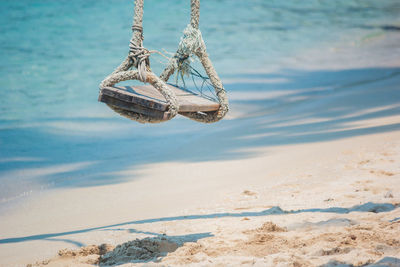 Rope swing hanging at beach