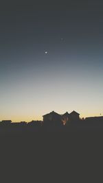 Built structure against sky at sunset