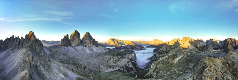 Tre cime di lavaredo - drei zinnen aerial panoramic overview from above in the first light