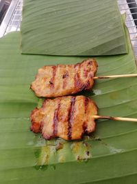 High angle view of leaves on barbecue grill