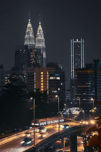 Illuminated buildings in city at night