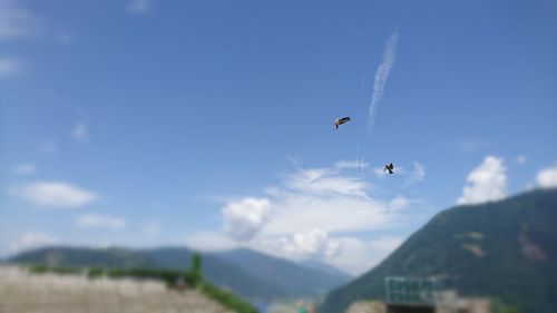 Low angle view of parachute against clear sky