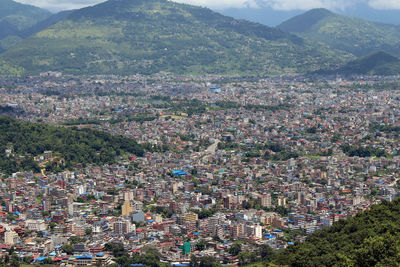 High angle view of townscape against mountains