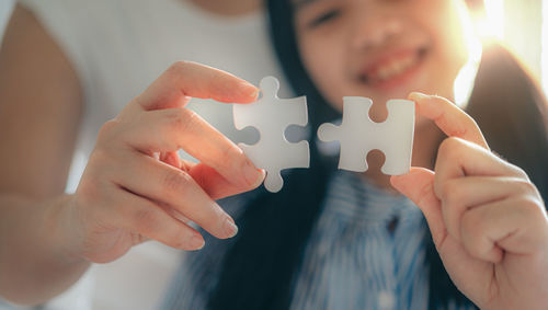 Close-up of people holding hands