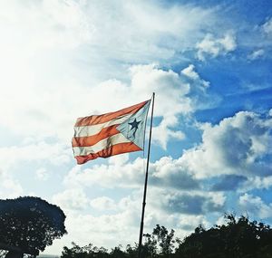 Low angle view of flag against sky