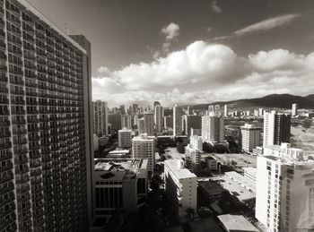 High angle view of buildings in city against sky