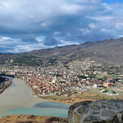 Aerial view of town against sky