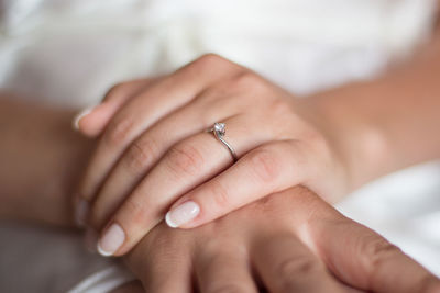 Midsection of bride wearing wedding ring