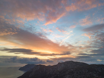 Scenic view of mountains against sky during sunset