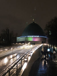 View of illuminated city at night during winter