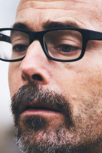 Close-up portrait of man wearing eyeglasses