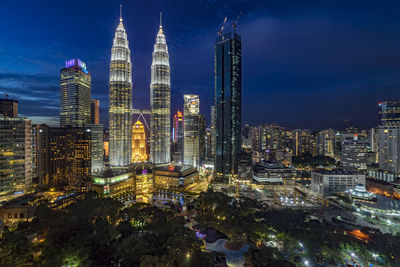 View of skyscrapers lit up at night