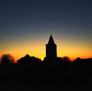 Silhouette of church at sunset
