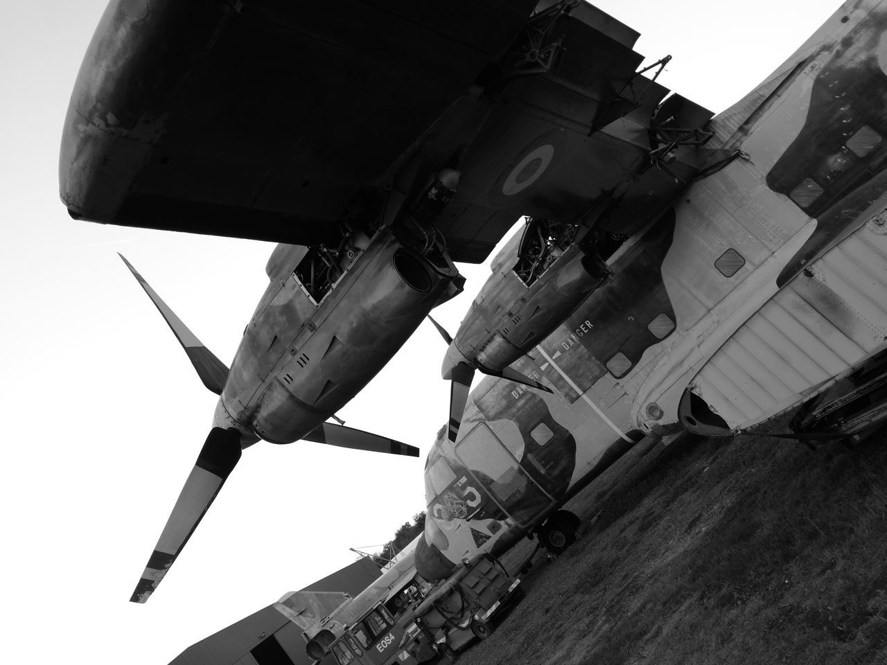 LOW ANGLE VIEW OF AIRPLANE AGAINST CLEAR SKY