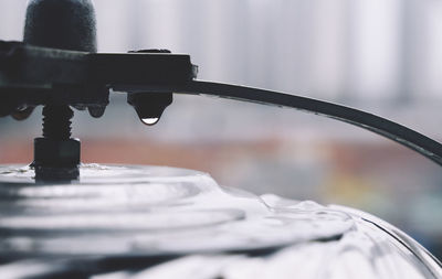 Close-up of wet metal during monsoon