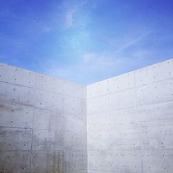 Low angle view of built structure against blue sky