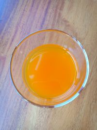 Close-up of orange tea on table