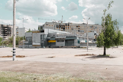 Built structures on field against sky