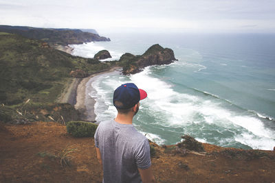 Rear view of man at beach