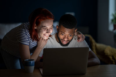 Young woman using laptop at home