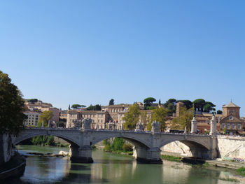 Bridge over river against clear sky