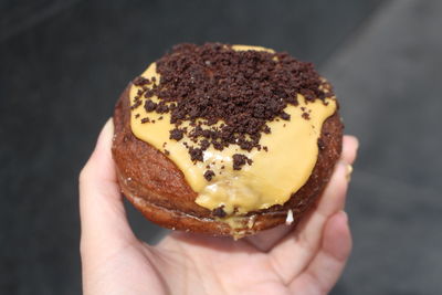 Close-up of hand holding ice cream