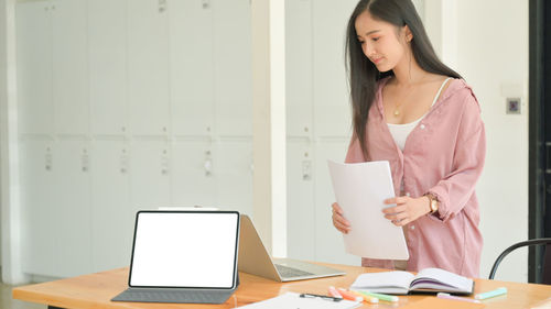 Woman using laptop on table