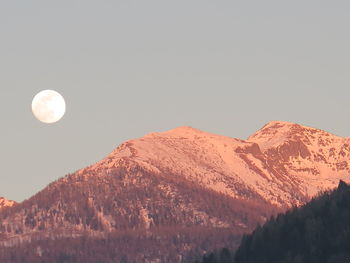 Low angle view of majestic mountains against clear sky