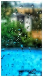 Close-up of raindrops on glass window