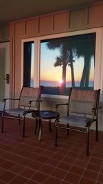 Empty chairs at sunset