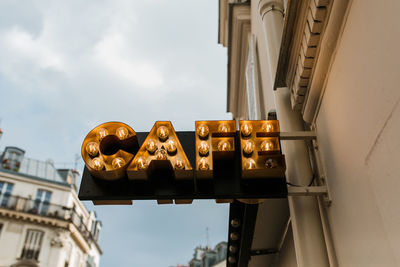 Café sign in paris with lights