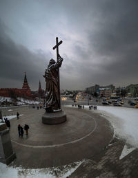 Statue in city during winter