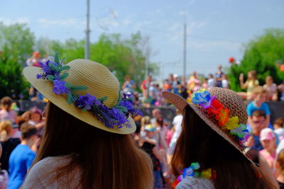 People wearing hat against sky