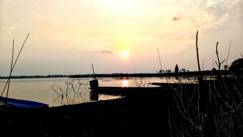 Scenic view of lake against sky during sunset