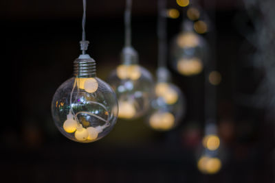 Close-up of illuminated light bulb