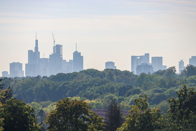 Buildings in city against sky