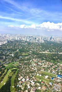 High angle view of city buildings against sky