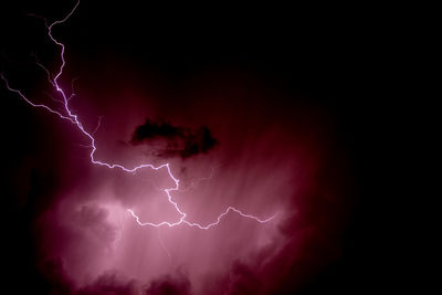 Low angle view of lightning in sky at night