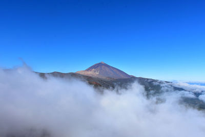 View of majestic mountain against blue sky