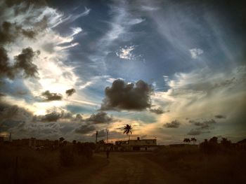 Scenic view of landscape against cloudy sky