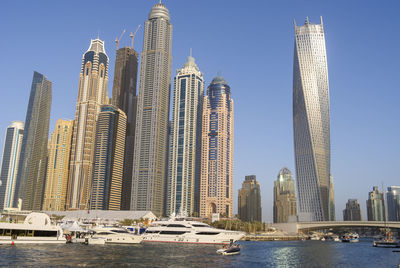 Dubai marina city skyscrapers with yachts.