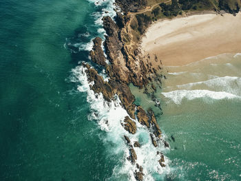 High angle view of rock formation in sea