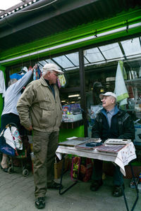 People at market stall