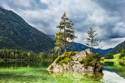 Scenic view of lake and mountains against sky