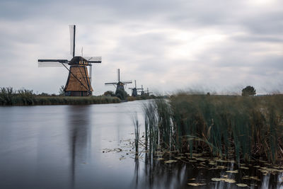 Historic windmill on the water's edge in the netherlands.