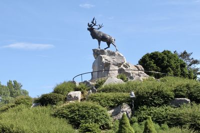 Low angle view of statue against sky